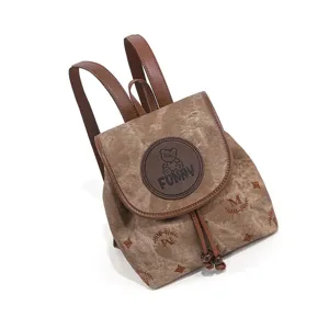 Stijlvolle bruine monogram canvas rugzak voor dames, casual vintage dagrugzak met riemen.