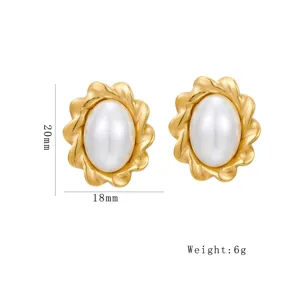 Elegant gold pearl stud earrings with wavy floral metal design, modern fashion jewelry for women.