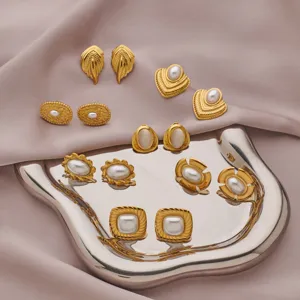Vintage gold-tone pearl stud earrings set, geometric metal design for women elegant jewelry.