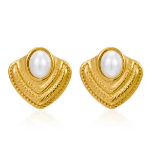 Detail view of 18k gold plated stainless steel geometric pearl stud earrings, vintage design.