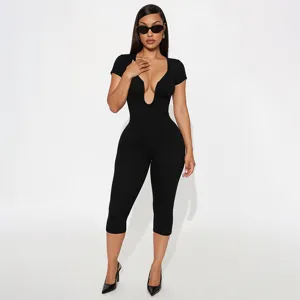 Black U-neck short sleeve cropped jumpsuit detail view, showing fitted stretch silhouette.