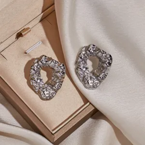 Chic irregular molten metal stud earrings for women and men, trendy stainless steel jewelry.