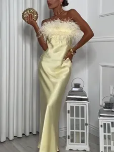Elegant strapless satin long dress featuring fluffy feather trim for glamorous evening party wear.