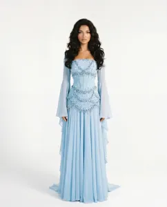 Close-up detail of light blue evening gown featuring intricate bead embroidery and sheer bell sleeves.