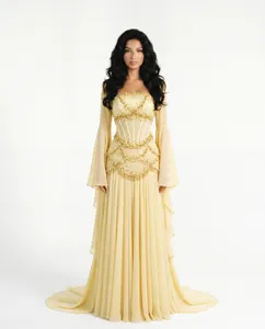Elegant yellow evening gown with beaded corset bodice and sheer bell sleeves for events.