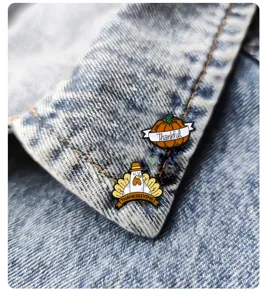 Thanksgiving pumpkin and turkey enamel brooch set, cute holiday fashion badge accessory.