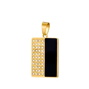 Gold rectangular pendant detail featuring studded clear rhinestones and smooth black enamel inlay.