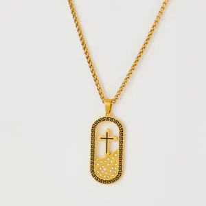 Gold stainless steel cross pendant necklace with black enamel border and shiny crystal stones.