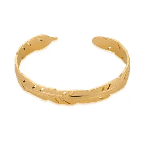 Detailed view of the 18k gold plated stainless steel feather cuff bracelet for women elegant.