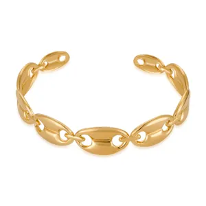 Gold puffed link bracelet detail shot, elegant stainless steel geometric open cuff design.