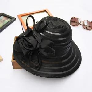 Elegant black organza women dress hat detail, perfect summer beach sun protection accessory.