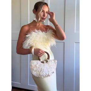 Elegant strapless satin long dress with fluffy feather detail and matching sequin bag.