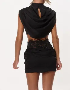 Back view of a stylish black two-piece outfit with high neck and lace corset skirt detail.