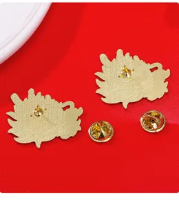 Detail view of gold-plated alloy dragon enamel pin backs with secure clutch closures.