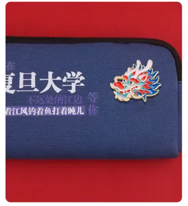 Canvas pencil case with Chinese dragon enamel pin, creative cultural design, stylish accessory.