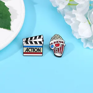 Cartoon cinema theme enamel pins set, cute popcorn and clapperboard metal badge brooches.