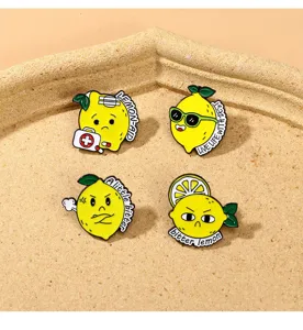 Close-up detail shot of cute cartoon lemon enamel pins set, alloy badge for clothing decor.