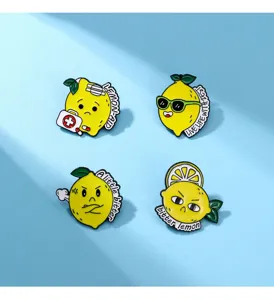 Close-up of cute cartoon lemon enamel pins, creative fruit brooch badges, detailed metal item.
