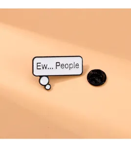 Close-up detail of the funny enamel pin featuring Ew People quote in a white speech bubble.