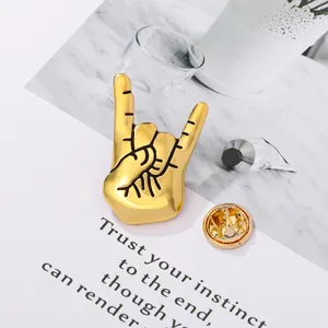 Gold metal rock hand gesture brooch pin stylish clothing accessory for concert outfit