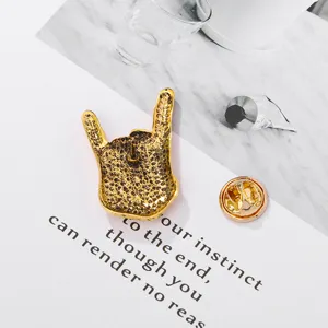 Gold rock gesture brooch pin, vintage alloy lapel badge for concert clothing accessories.