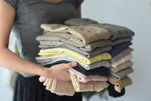 Close-up detail of stacked ribbed leggings in assorted Morandi colors for comfort.
