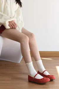 Detailed shot of fleece-lined fake translucent pantyhose with cute heart pattern for winter.