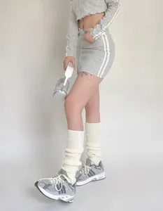 Detailed view of winter classic knitted leg warmers, warm and cozy knit sock covers.