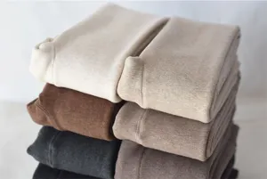 Detailed view of thick fleece-lined winter thermal leggings, soft warm fabric in assorted colors.
