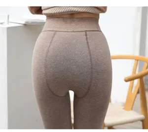 Detail view of high-waist fleece-lined ribbed thermal leggings in oatmeal coffee brown.