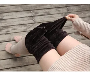 Thick fleece lined stirrup tights detail view showing warm plush interior and soft winter fabric.