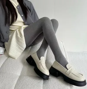 Winter warm knit tights grey herringbone pattern women footed leggings detail view