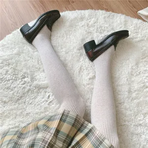 Women oatmeal ribbed tights cute JK style pantyhose with vintage loafers detailed close up view