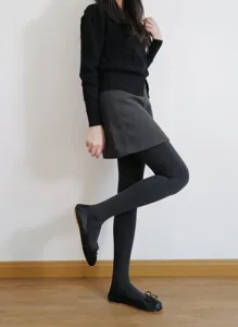 Dark grey ribbed tights detail, classic winter textured leggings for stylish daily autumn outfits.