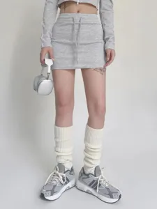Knitted leg warmers detail display, showcasing soft ribbed texture and warm cozy fit.