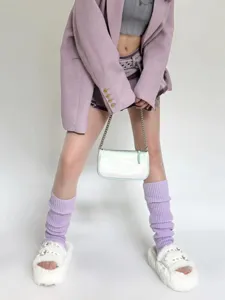 Cozy purple knit leg warmers and fashion stack socks detail shot, perfect for autumn winter.