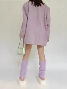 Details of purple knit stirrup leg warmers with fuzzy slippers for autumn winter fashion outfit