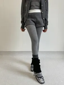 Detailed view of grey polka dot fleece lined tights showcasing jacquard pattern and texture.