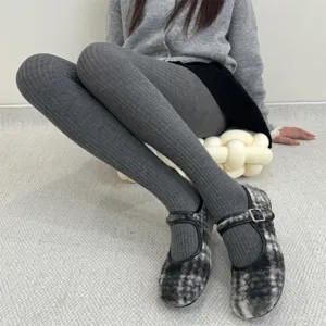 Detail view of dark grey ribbed thermal tights featuring soft knit fabric and comfortable wear.