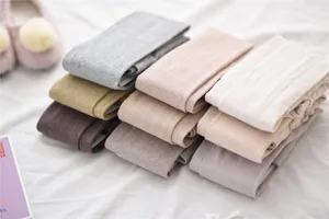 Detailed view of winter women vertical striped leggings soft cotton knit warm tights apparel