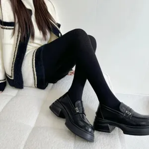 Stylish women's knit tights paired with platform loafers and tweed jacket for autumn winter.