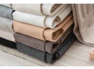 Ribbed fleece-lined tights detail, thick warm winter pantyhose stack texture display