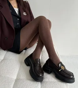 Brown thermal knit tights featuring stylish herringbone pattern for cozy winter daily wear.