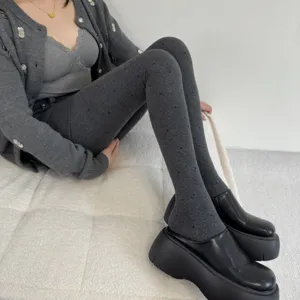 Grey polka dot jacquard knit tights detail, comfortable winter warm base layer leggings.
