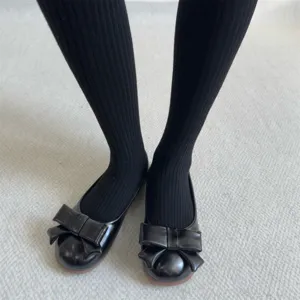 Black ribbed warm winter tights for women, stylish thick fleece lined thermal socks.