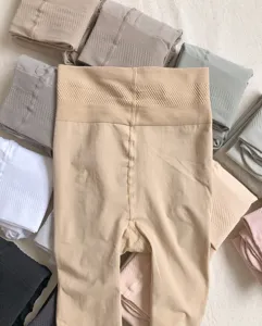 Detailed view of high-waist cozy fleece lined tights, soft nylon material for winter.