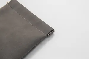 Grey leather spring pouch earphone cable organizer small items storage coin purse detail