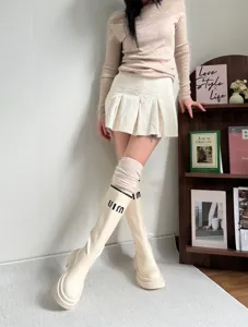 Women cozy over the knee cotton socks and stylish slouchy calf socks for autumn winter outfit.