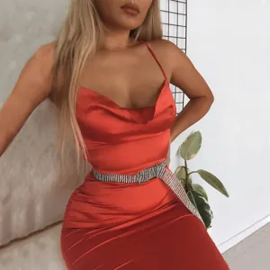 Elegant red satin slip dress for women featuring a sparkling rhinestone belt and chic style.