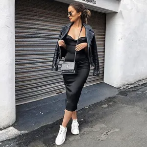 French style black slip dress paired with leather jacket and casual sneakers for women.